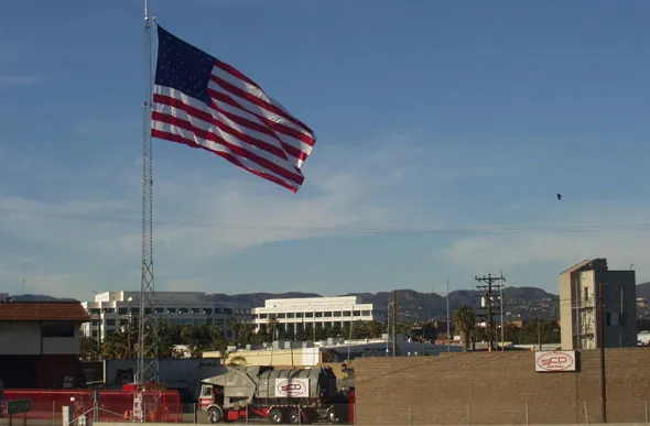 The giant American flag flying from SCD's 100-foot tower over its Santa Monica yard, with an SCD truck below